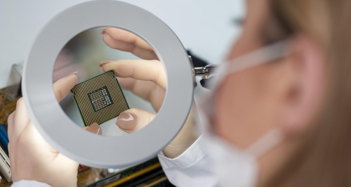 Close-up of a woman looking at a chip